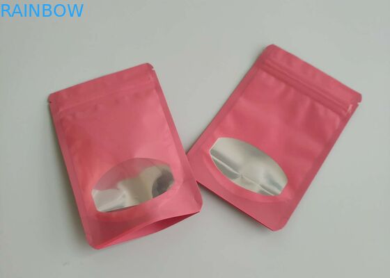 Malotes plásticos das cores diferentes que empacotam sacos dos doces do fruto do chocolate com claramente a janela