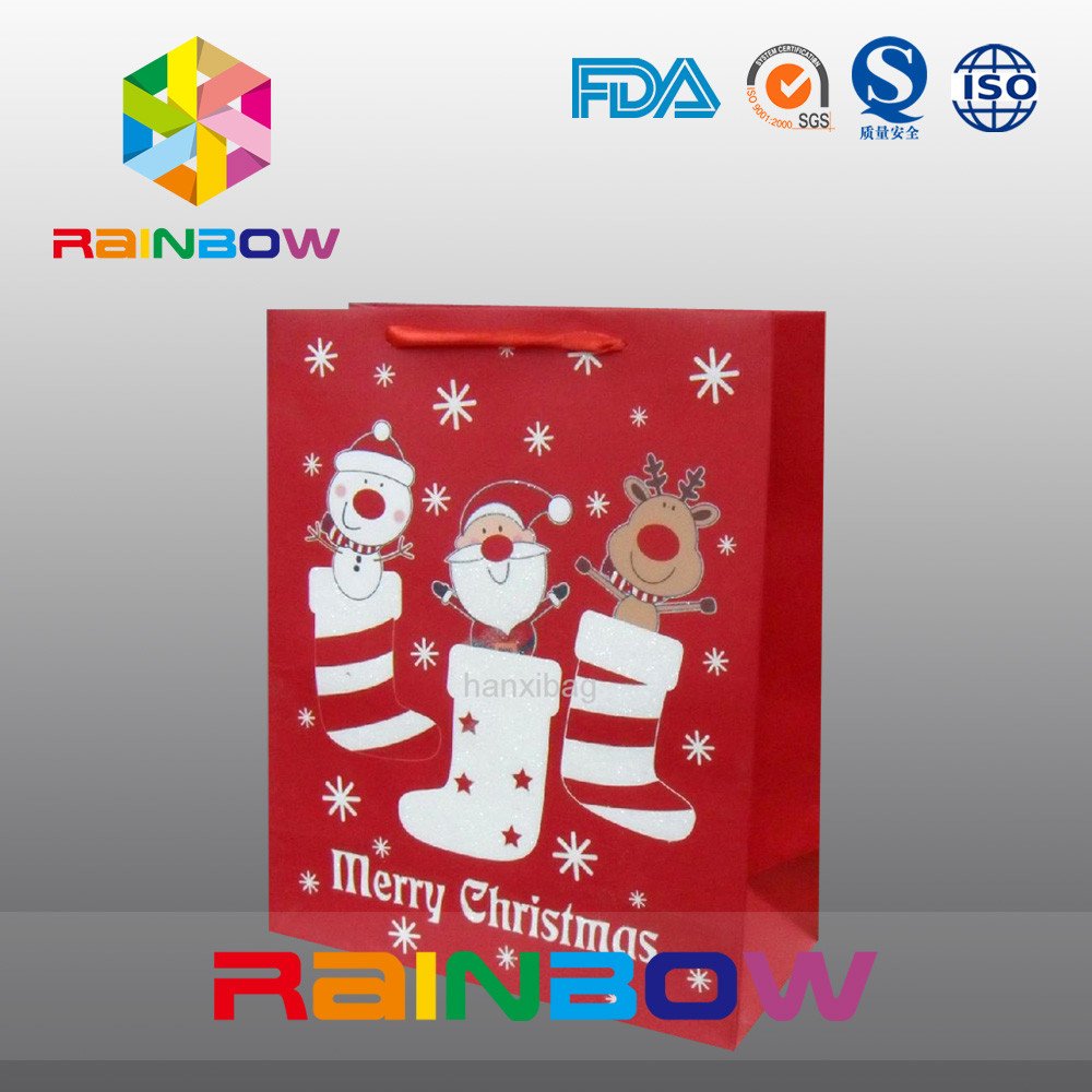 O vermelho personalizou o saco do presente do Natal dos sacos de papel com corda vermelha/bonito impresso